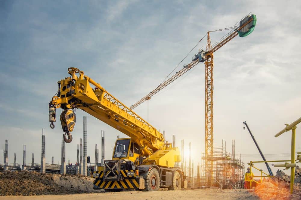 A mobile crane and a tower crane on a large construction site